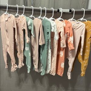 Assorted Baby Onesies in Pastel and Floral Patterns